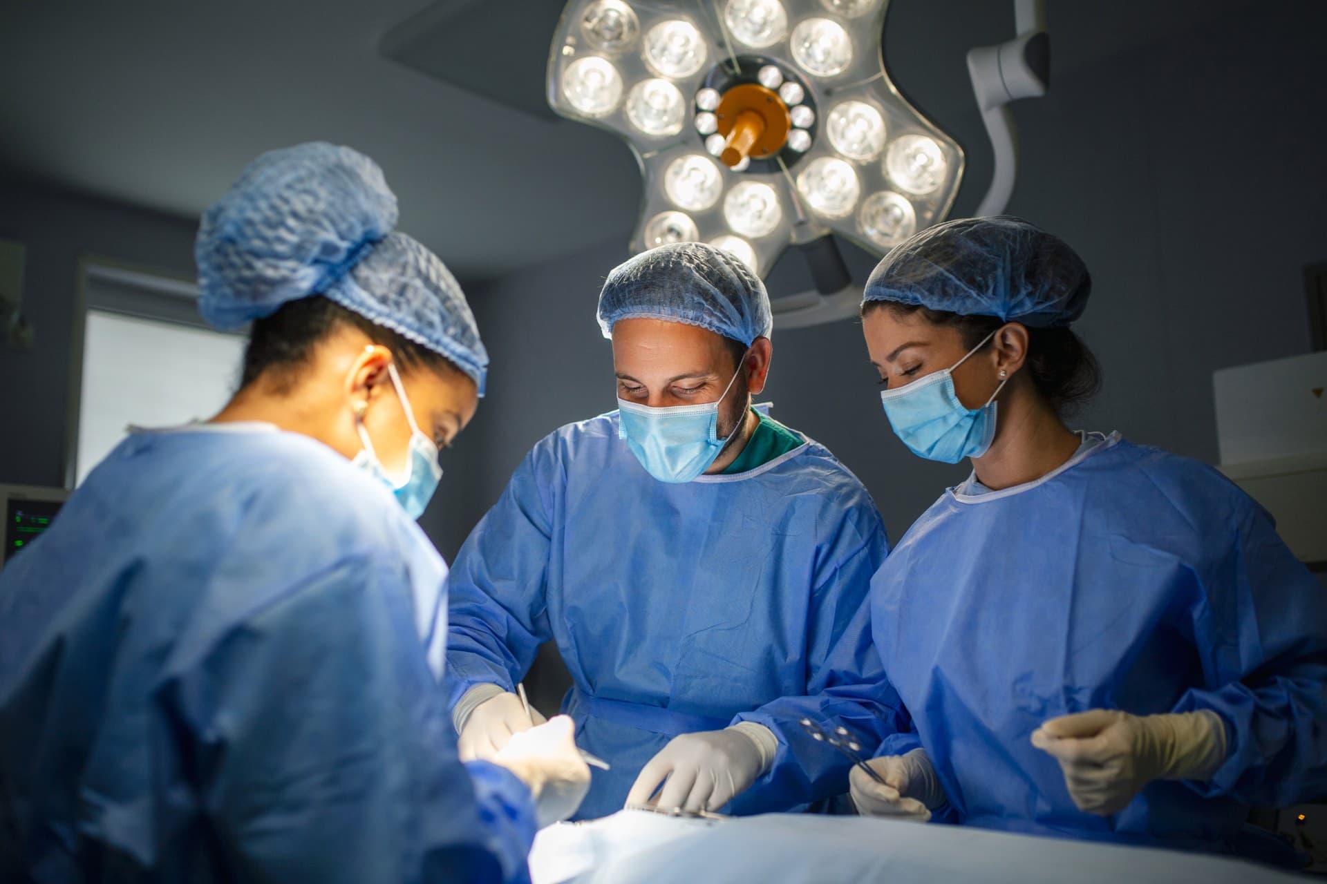 Surgical team in theatre — the Liquid Cartilage™ keyhole-surgery setting